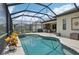 Enjoy this lovely kidney-shaped pool and spa, screened-in for ultimate relaxation at 5713 Cheech Gln, Lakewood Ranch, FL 34211