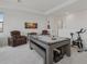 Spacious game room with pool table and exercise bike at 5713 Cheech Gln, Lakewood Ranch, FL 34211