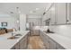 Modern kitchen with gray cabinets, quartz countertops, and stainless steel appliances at 5713 Cheech Gln, Lakewood Ranch, FL 34211