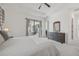 Main bedroom with king bed, dresser, and backyard access at 5713 Cheech Gln, Lakewood Ranch, FL 34211