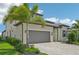 Two-story home features a gorgeous gray tile roof and manicured landscaping at 5713 Cheech Gln, Lakewood Ranch, FL 34211