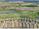Aerial view of neighborhood with golf course at 5713 Cheech Gln, Lakewood Ranch, FL 34211