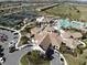 Community clubhouse with pool and tennis courts at 5713 Cheech Gln, Lakewood Ranch, FL 34211