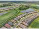 Aerial view of a golf course community with many houses at 5713 Cheech Gln, Lakewood Ranch, FL 34211