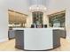 Community center reception area with modern design and wine storage at 5713 Cheech Gln, Lakewood Ranch, FL 34211