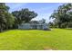 View of the back of the light blue house at 105 2Nd Se Ave, Ruskin, FL 33570