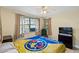 Cozy bedroom with a double bed and window at 105 2Nd Se Ave, Ruskin, FL 33570