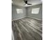 Spacious bedroom with neutral walls and wood-look flooring at 20570 Tappan Zee Dr, Port Charlotte, FL 33952