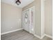 Light and airy entryway with wood-look flooring at 3549 Rossmere Rd, Port Charlotte, FL 33953