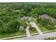 One-story home with tile roof, three car garage, and circular driveway at 714 Vanderbilt Dr, Nokomis, FL 34275