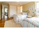 Bright bedroom with twin beds, hardwood floors, and access to a shared bath at 447 Canal Rd # 447, Sarasota, FL 34242