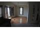 Inviting dining room featuring hardwood floors, natural light, and a charming chandelier at 6064 Shearwater Dr, Englewood, FL 34224