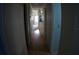 Hallway with wood flooring leads towards the living area at 6064 Shearwater Dr, Englewood, FL 34224