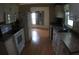 Efficient kitchen with white appliances and ample counter space at 6064 Shearwater Dr, Englewood, FL 34224