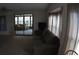 Comfortable living room with furniture, natural lighting, and access to a sunroom at 6064 Shearwater Dr, Englewood, FL 34224