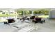 Community patio offers comfortable seating, picnic tables, and a scenic view of the water at 6064 Shearwater Dr, Englewood, FL 34224