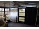 Enclosed sun room with large windows and a ceiling fan, offering a bright and airy space at 6064 Shearwater Dr, Englewood, FL 34224