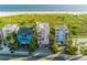 Beachfront homes with a rooftop pool, offering stunning views of the ocean and coastline at 648 Beach Rd, Sarasota, FL 34242