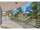 Balcony offers ocean views, palm trees, and ample room for outdoor seating at 648 Beach Rd, Sarasota, FL 34242