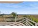 A beautiful balcony overlooks the beach and palm trees at 648 Beach Rd, Sarasota, FL 34242