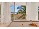Billiards room with ocean view, natural light and access to a balcony at 648 Beach Rd, Sarasota, FL 34242