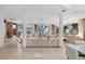 Bright and airy living room with neutral tones, showcasing ocean views from every window at 648 Beach Rd, Sarasota, FL 34242