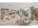 Bright living room with plush seating and sliding doors opening to beach view at 648 Beach Rd, Sarasota, FL 34242