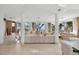 Expansive living room featuring modern decor, tile floors and panoramic ocean views at 648 Beach Rd, Sarasota, FL 34242