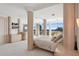 Bright bedroom with ocean views, built-in shelves, and luxurious furnishings at 648 Beach Rd, Sarasota, FL 34242