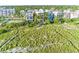 Scenic shot of the grassy land near the beach houses showcasing the beautiful area at 648 Beach Rd, Sarasota, FL 34242