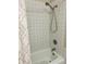 Simple bathroom with shower/tub combo and tiled walls at 906 Tropical Dr, Bradenton, FL 34208