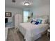 Bedroom with a queen-size bed and vintage dresser at 906 Tropical Dr, Bradenton, FL 34208