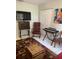 The living room has a piano, TV and unique decor at 906 Tropical Dr, Bradenton, FL 34208