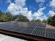 Home equipped with solar panels to help lower energy costs at 906 Tropical Dr, Bradenton, FL 34208
