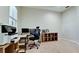 An office featuring a neutral color palette, desk, printer, and shelving at 924 Preservation St, Bradenton, FL 34208