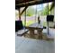 Unique hanging picnic table on the patio at 906 Tropical Dr, Bradenton, FL 34208