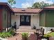 Front entry of home with double doors and brick steps at 906 Tropical Dr, Bradenton, FL 34208