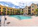 Community pool with lounge chairs and patio area at 1810 E Palm Ave # 5204, Tampa, FL 33605