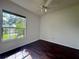 Spacious bedroom with dark wood flooring and a large window at 22105 Deer Pointe Xing, Bradenton, FL 34202
