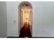 Elegant hallway with hardwood floors leading to bathroom at 22105 Deer Pointe Xing, Bradenton, FL 34202