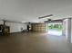 Spacious three-car garage with view of backyard at 22105 Deer Pointe Xing, Bradenton, FL 34202