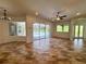 Spacious living area with tile floors and sliding doors to the pool at 22105 Deer Pointe Xing, Bradenton, FL 34202