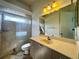 Bathroom with shower, toilet, and vanity at 22105 Deer Pointe Xing, Bradenton, FL 34202