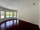 Spacious Gathering room featuring hardwood floors and pool view at 22105 Deer Pointe Xing, Bradenton, FL 34202