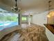 Bright living room with tile flooring and pool view at 22105 Deer Pointe Xing, Bradenton, FL 34202