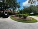 Landscaped front yard with circular driveway and home at 22105 Deer Pointe Xing, Bradenton, FL 34202