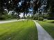 Quiet residential street with sidewalk and lush landscaping at 22105 Deer Pointe Xing, Bradenton, FL 34202