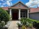 Home exterior featuring a red tile roof and columns at 22105 Deer Pointe Xing, Bradenton, FL 34202