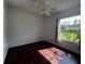 Bright bedroom featuring wood-look flooring and a window at 22105 Deer Pointe Xing, Bradenton, FL 34202