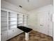 Home office with built-in shelving and large desk at 22105 Deer Pointe Xing, Bradenton, FL 34202